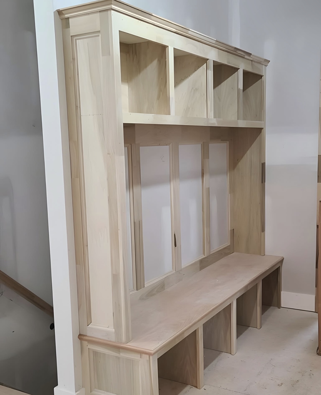 Custom-built entryway bench with upper cubbies and detailed trim work installed by BR Home Repairs
